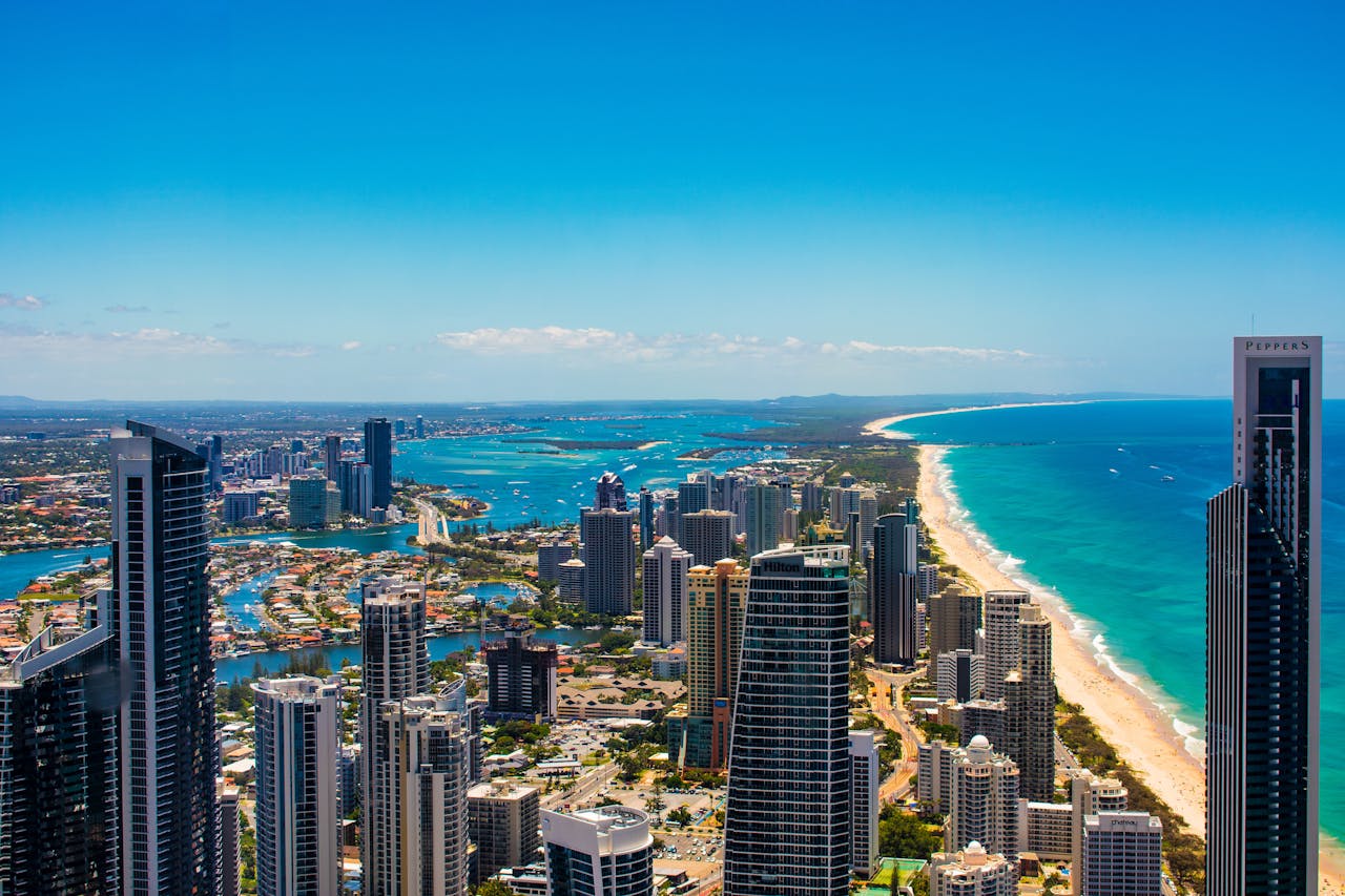 Breathtaking aerial cityscape of Gold Coasts skyscrapers, beaches, and ocean.